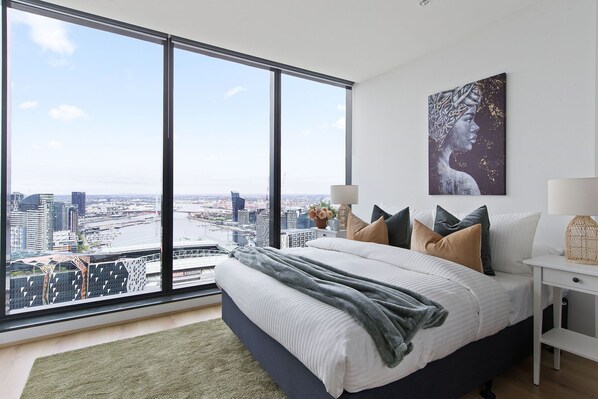 The master bedroom with a queen sized bed & an amazing view.