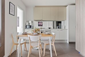 An equipped kitchen & dining area.
