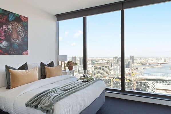 The master bedroom with a queen sized bed & an amazing view.