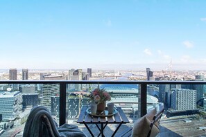 Enjoy the view of Docklands harbour from the balcony.