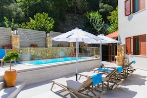 Private pool with outdoor furniture and pool furniture