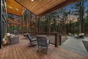 There is ample seating on the outdoor deck so everyone can gather and relax in the great outdoors.