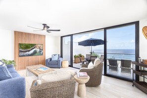 Living room and Lanai - Thoughtful design meet laid back vibes at the completely renovated Puu Poa 309.