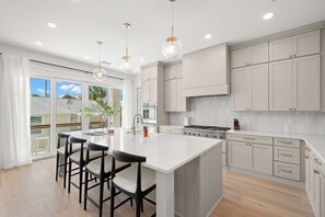 Beautiful Kitchen Stocked with Cooking Utensils and Coffee Maker