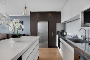 A modern kitchen with all the essentials needed to cook meals if preferred.