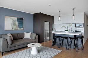 The open-plan living and kitchen area is an excellent use of space in this apartment.