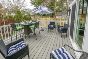 The outdoor deck is conveniently accessible from both the master bedroom and the living room area.