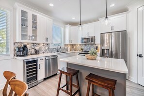 Fully Stocked Kitchen with Stainless Steel Appliances, Coffee Maker, Wine Fridge, and Dishwasher