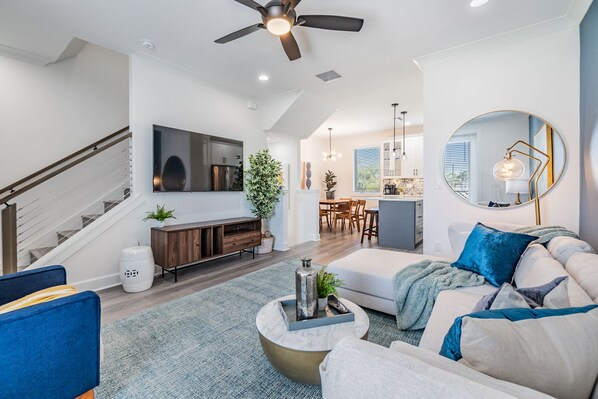Welcome to our cozy living room with Smart TV, board games, couch, armchair, throw blankets and pillows.  Great spot to relax and unwind after a day of traveling!