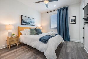 Sleep well in our luxurious bedding and plush mattress in Bedroom 1.  With Smart TV, blackout shades, end tables with charging stations, and en suite bathroom, you'll have everything you need for sleep and entertainment.