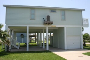 Back of home, paved driveway