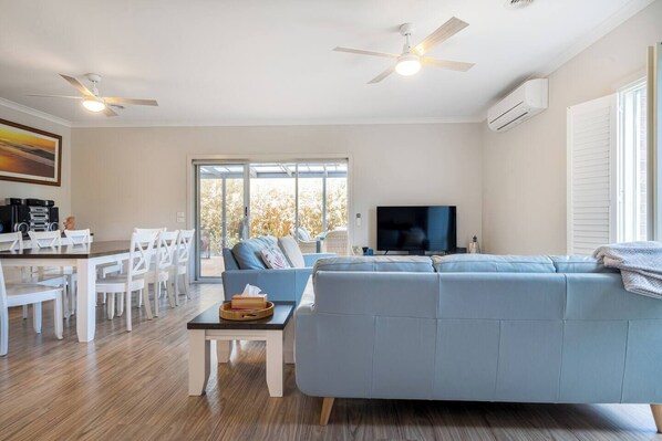 The living and dining rooms are open-plan and flow to the back deck, creating a lovely transition between indoors and out.
