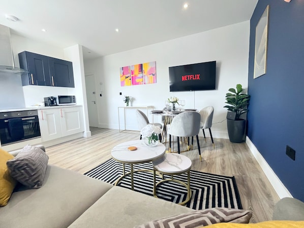 Living area with 50" Smart LED TV with free Netflix.