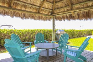 Gather with family & friends under the chickee hut.
