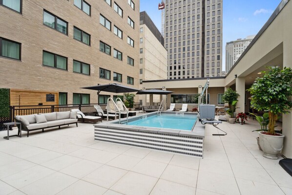 Rooftop Pool with Lounge Chairs + Hot Tub