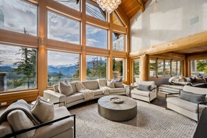 Open plan main living room with wood-burning fireplace.