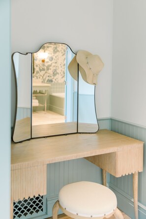Start the day in peaceful reflection at a charming vanity where soft tones and natural light set the tone.