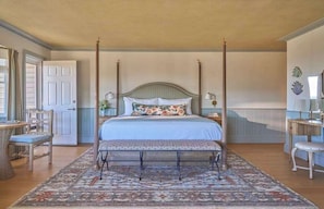 Wake to sweeping views and graceful style in a room that blends timeless elegance with relaxed luxury.