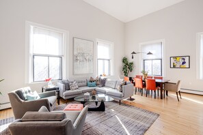 Main living space with 20' ceilings and abundant light - view when entering