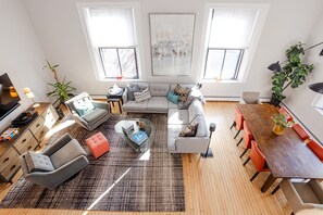 Main living space with 20' ceilings and abundant light - view from 2nd floor
