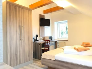 Deluxe Dreibettzimmer mit eigenem Bad