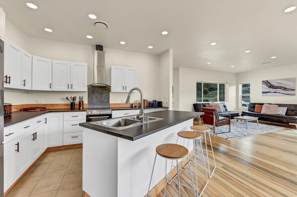 Kitchen with the lounge area in the background 