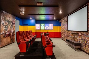 Kick back and relax in the in-home superhero themed movie theatre.