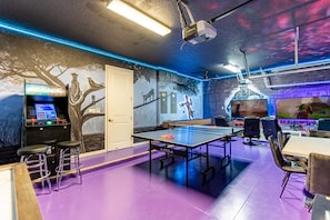 Garage-turned-games-room with air hockey, foosball, game consoles and more!