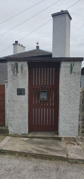 Gate leading to front entrance