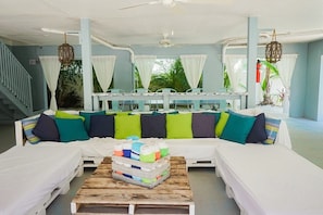Lounge seating, 1200 sq ft covered outdoor space. Includes a flat screen tv, ping pong table, jumbo jenga and more.