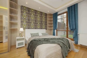 Comfortable double bed in the bedroom. 