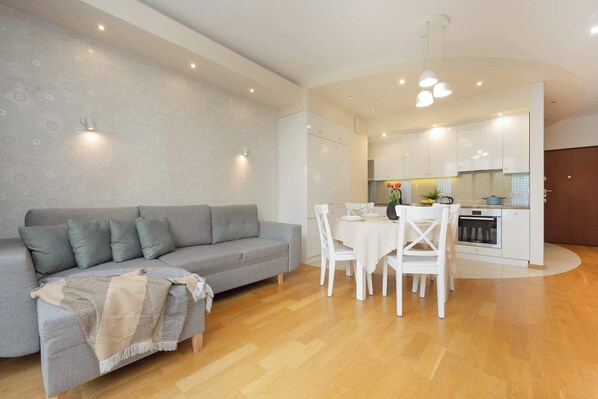 Living room with a comfortable sofa and TV. 