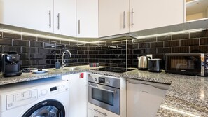 With modern appliances and tasteful design, our kitchenette is the perfect space to cook a delicious snack #practical #simple