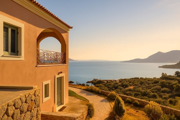 Panoramic Terrace Views
Watch the sun set over olive groves and hills from this elevated perch.