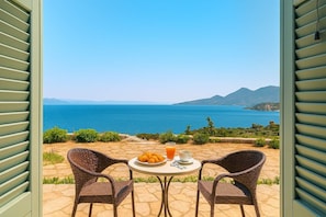 Serene View from the Room
Wake up to peaceful landscapes framed by shuttered windows.