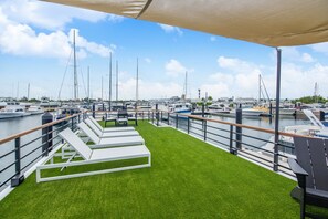 Rooftop With Lounge Chairs and Dining