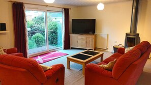 Lounge with 50" TV & log burner