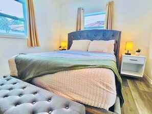Modern, bedroom with windows to enjoy natural light.