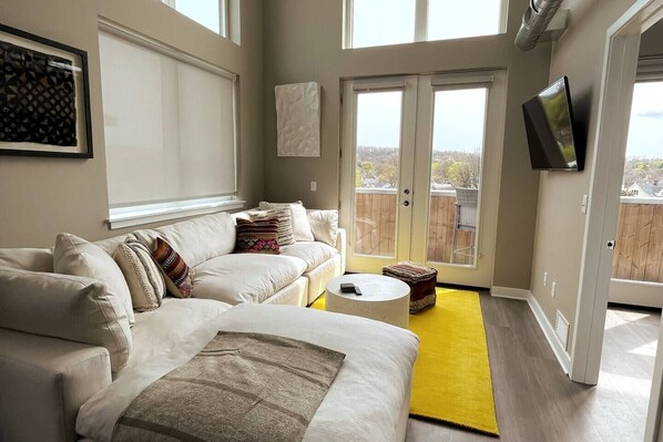 Living Room Area with clerestory windows and view of the terrace beyond