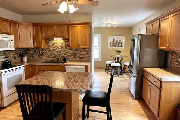 Beautiful modern kitchen with dine-in island