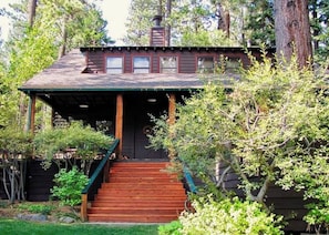 Rear deck of house, steps to back yard lawn and garden