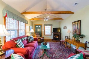Living room with Smart TV and gas log fireplace
