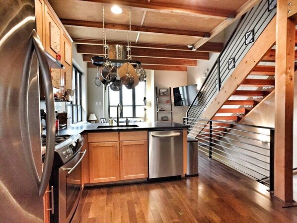 Well-stocked kitchen with stainless steel appliances, gas stove, and all the basics - including the owner's special stash of spices! The open kitchen lets the cook be part of all the action. 