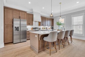 This kitchen is fully stocked and has a Keurig coffee maker with a few starter pods. 