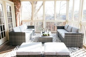 Relax and unwind on the screened-in porch, perfect for enjoying morning coffee or evening conversations. Comfortable seating and a serene view make this the ideal spot to unwind