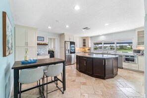 Hang out in the fully equipped kitchen just for the views.