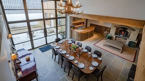 The fabulous dining room has a bar and sitting area with an open fire