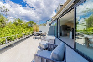 Relax and unwind with panoramic terrace vistas.



