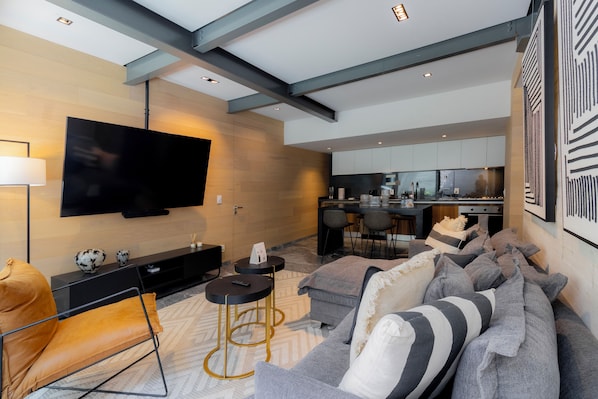 Fully furnished living room with TV.