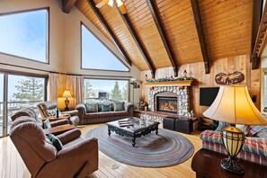 Floor-to-ceiling windows in the living area let in ample natural light.